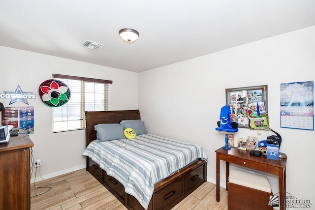 10120 S Galaxy Ave, Yuma, AZ 85367 - bedroom with baseboards, visible vents, and light wood-style flooring
