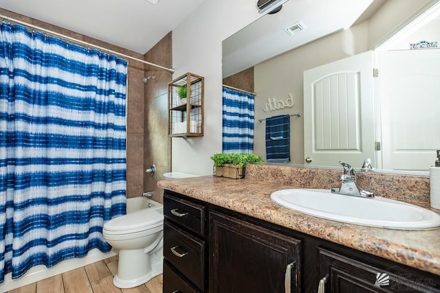 10120 S Galaxy Ave, Yuma, AZ 85367 - bathroom with visible vents, wood finished floors, shower / tub combo, vanity, and toilet