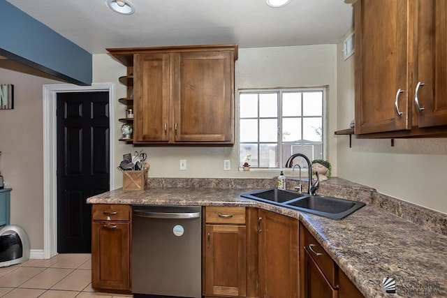 285 E 26th St, Yuma, AZ 85364 - kitchen featuring stainless steel dishwasher, dark countertops, open shelves, light tile patterned floors, and brown cabinetry