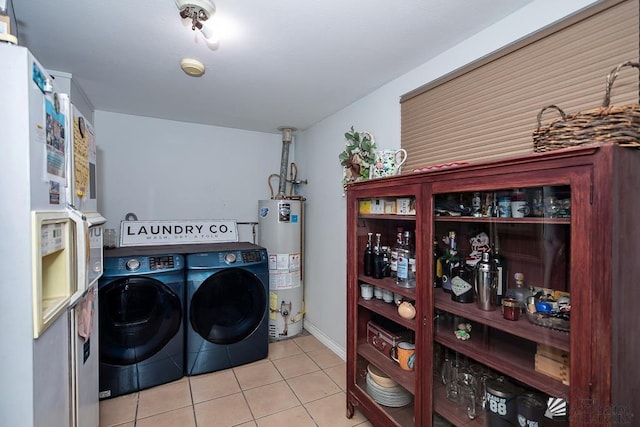 285 E 26th St, Yuma, AZ 85364 - laundry room with water heater, washer and dryer, and tile patterned flooring