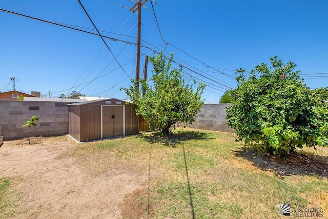 285 E 26th St, Yuma, AZ 85364 - fenced backyard with a storage unit