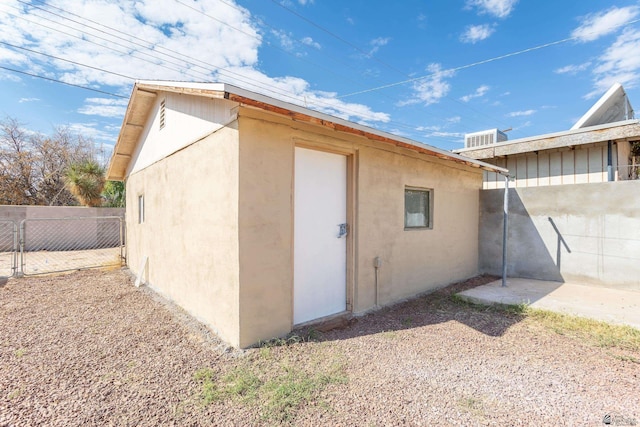 view of outdoor structure with fence
