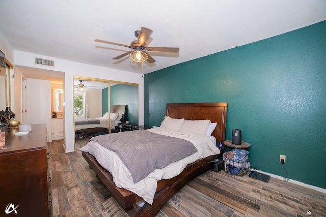 2231 S Elks Ln # 67, Yuma, AZ 85364 - bedroom featuring wood finished floors, a closet, a ceiling fan, and baseboards