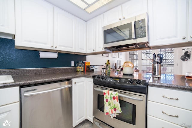 2231 S Elks Ln # 67, Yuma, AZ 85364 - kitchen with stainless steel appliances, dark countertops, and white cabinetry