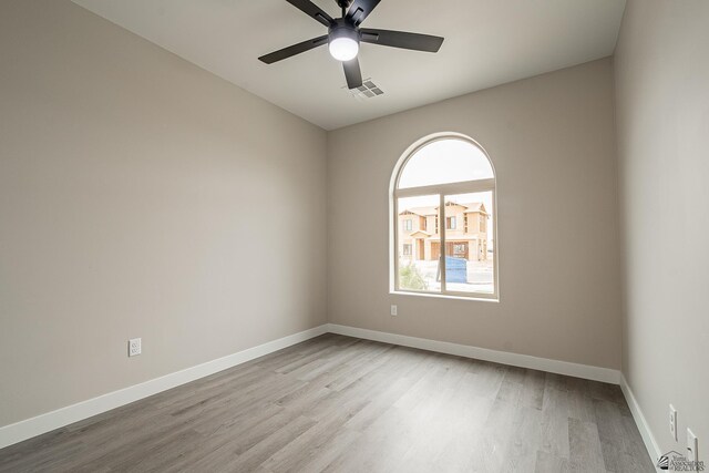 7972 E 34th Ln, Yuma, AZ 85365 - unfurnished room with visible vents, light wood finished floors, ceiling fan, and baseboards