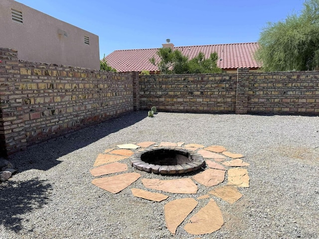 14713 E 52nd Dr, Yuma, AZ 85367 - fenced backyard with an outdoor fire pit
