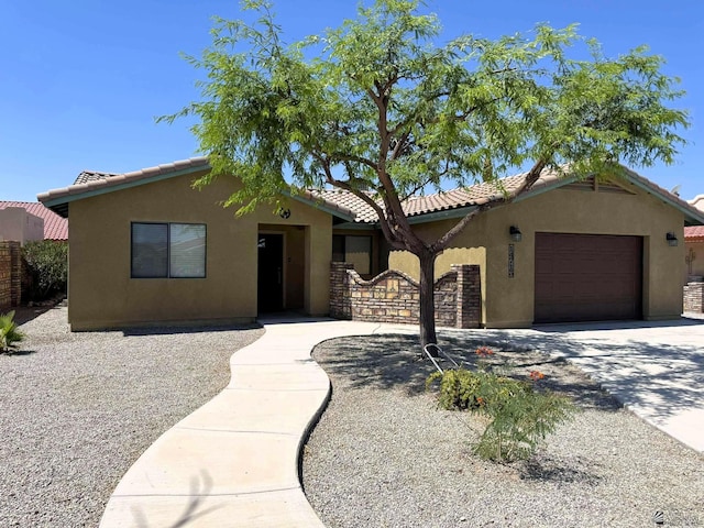 14713 E 52nd Dr, Yuma, AZ 85367 - view of front of property featuring a garage, stucco siding, driveway, and a tiled roof