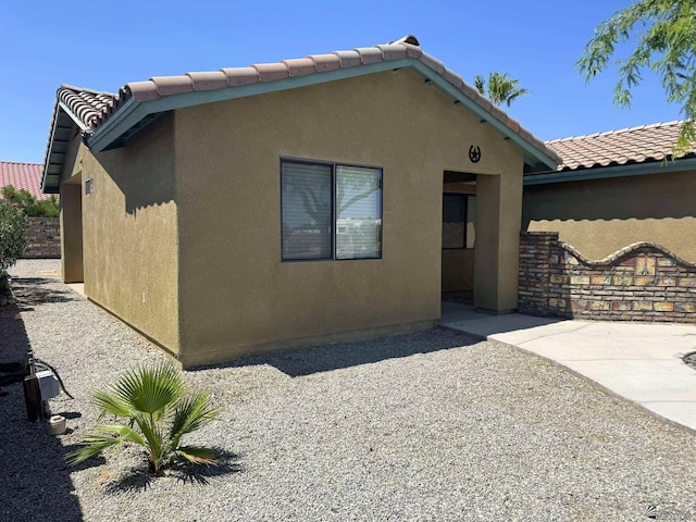 14713 E 52nd Dr, Yuma, AZ 85367 - view of front of property with a tiled roof, stucco siding, and a patio area