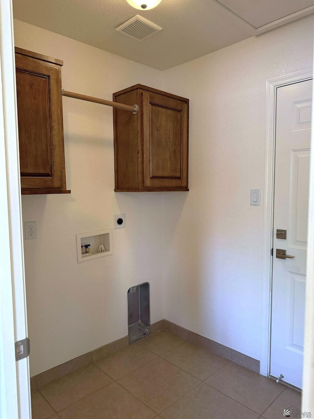 14713 E 52nd Dr, Yuma, AZ 85367 - washroom featuring cabinet space, hookup for an electric dryer, baseboards, hookup for a washing machine, and light tile patterned flooring