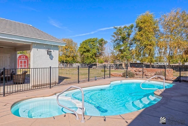 view of swimming pool featuring a fenced in pool, fence, and a patio