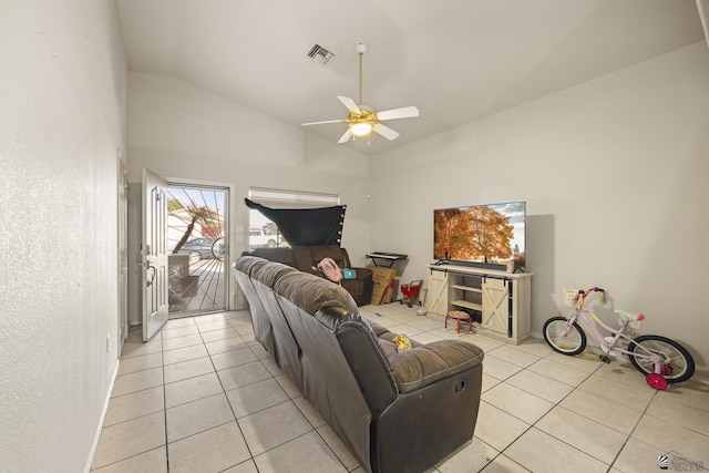 living area with visible vents, ceiling fan, light tile patterned floors, and high vaulted ceiling