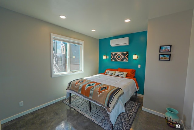 bedroom with recessed lighting, baseboards, concrete floors, and a wall mounted air conditioner