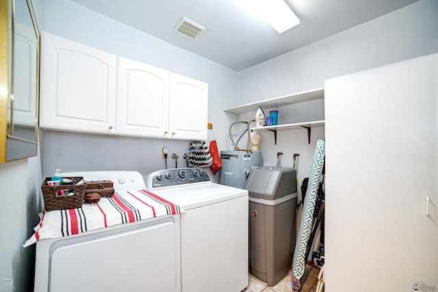 13252 E 54th Dr, Yuma, AZ 85367 - clothes washing area with washer and dryer, cabinet space, water heater, light tile patterned floors, and visible vents