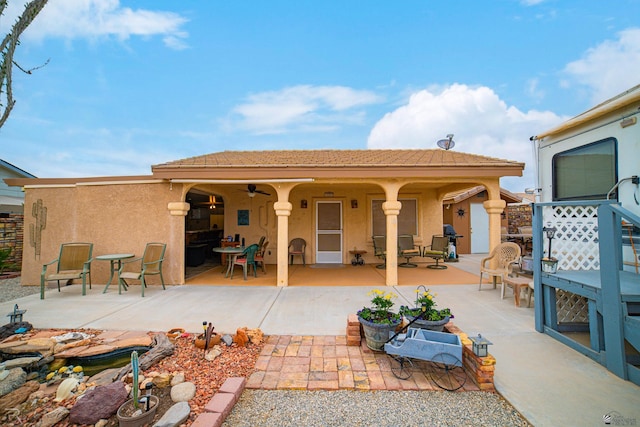 13252 E 54th Dr, Yuma, AZ 85367 - rear view of property with outdoor dining space, stucco siding, and a patio area