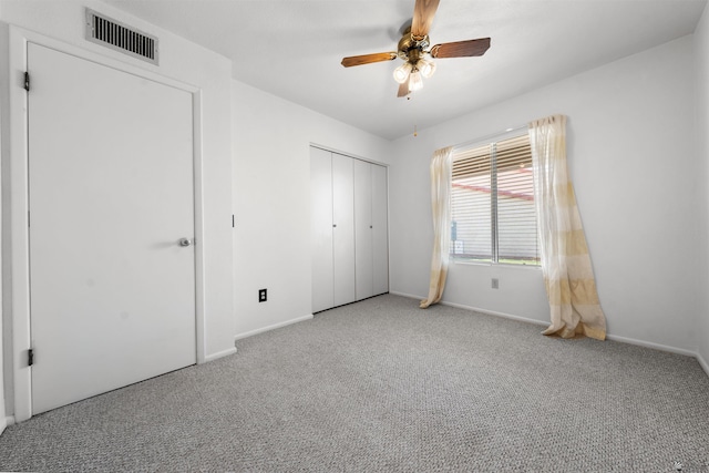 2155 S 14th Ave # 36, Yuma, AZ 85364 - unfurnished bedroom with a closet, carpet, baseboards, ceiling fan, and visible vents