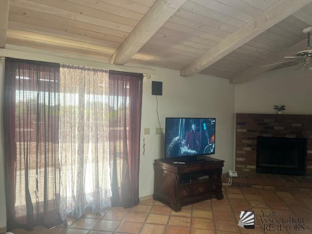 1432 S Sunset Dr, Yuma, AZ 85364 - living room with ceiling fan, a brick fireplace, wood ceiling, and light tile patterned flooring
