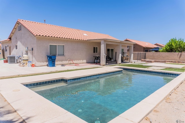 11519 E Del Verde St, Yuma, AZ 85367 - view of swimming pool with central AC and a patio area