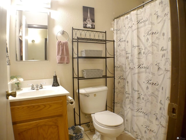 bathroom featuring vanity, tile patterned floors, a shower with curtain, and toilet