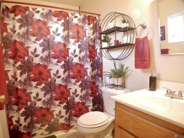 bathroom with vanity, toilet, and a shower with shower curtain