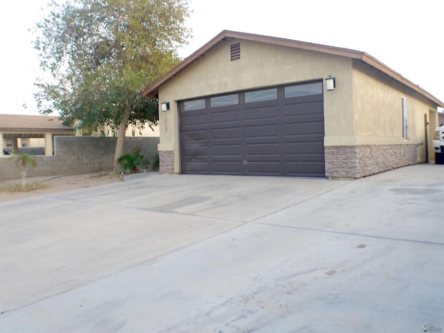 garage with fence