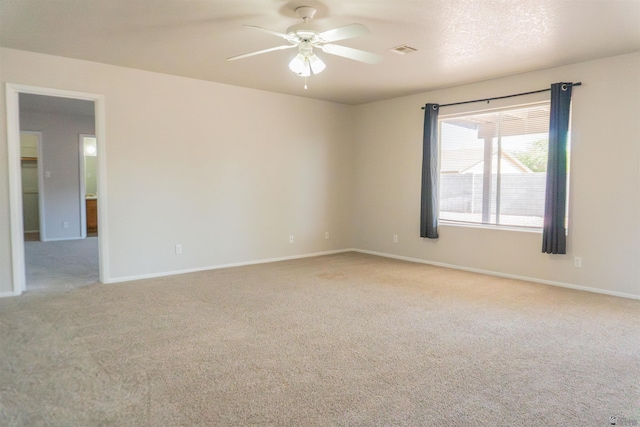 6351 E 41st St, Yuma, AZ 85365 - empty room with light colored carpet, ceiling fan, and baseboards