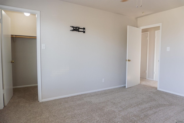 6351 E 41st St, Yuma, AZ 85365 - unfurnished bedroom with a spacious closet, carpet floors, a closet, and baseboards