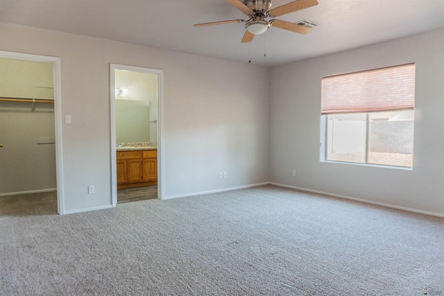 6351 E 41st St, Yuma, AZ 85365 - unfurnished bedroom with carpet flooring, a spacious closet, and baseboards