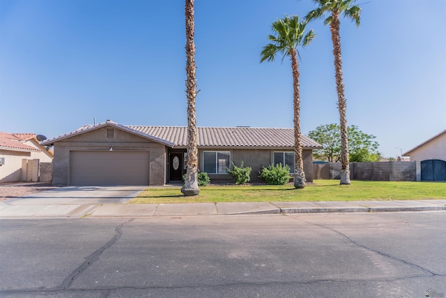 6351 E 41st St, Yuma, AZ 85365 - single story home with an attached garage, stucco siding, driveway, and a tile roof