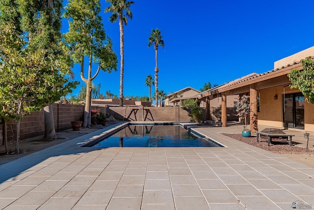 view of swimming pool featuring a patio area