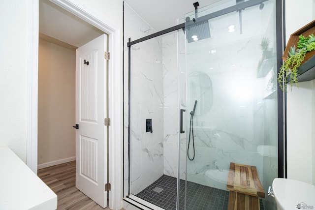 1700 S Crowder Ave Unit 17, Yuma, AZ 85364 - bathroom with a marble finish shower and wood finished floors