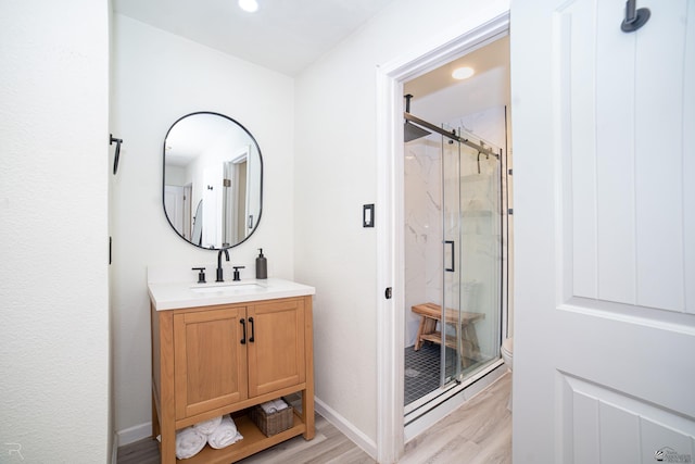 1700 S Crowder Ave Unit 17, Yuma, AZ 85364 - bathroom with wood finished floors, a marble finish shower, vanity, and recessed lighting