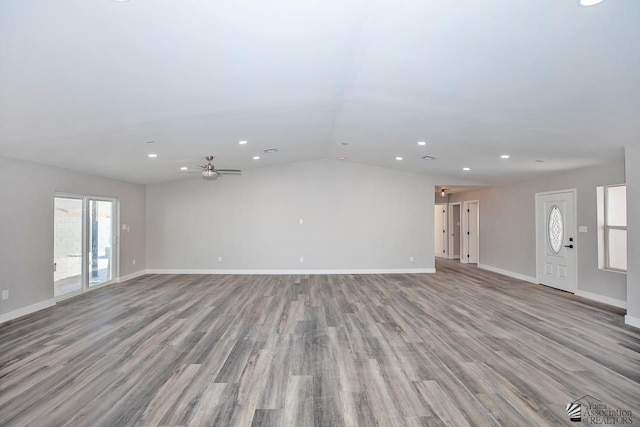unfurnished living room featuring wood finished floors, lofted ceiling, a ceiling fan, and recessed lighting