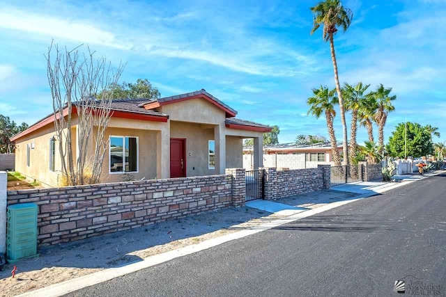 13459 E 43rd Ln, Yuma, AZ 85367 - bungalow-style home featuring fence private yard, a gate, stucco siding, and a tiled roof