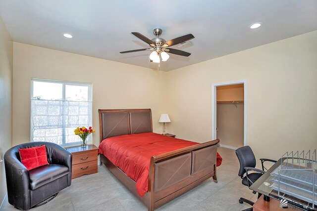13459 E 43rd Ln, Yuma, AZ 85367 - bedroom featuring recessed lighting, ceiling fan, light tile patterned floors, and a walk in closet