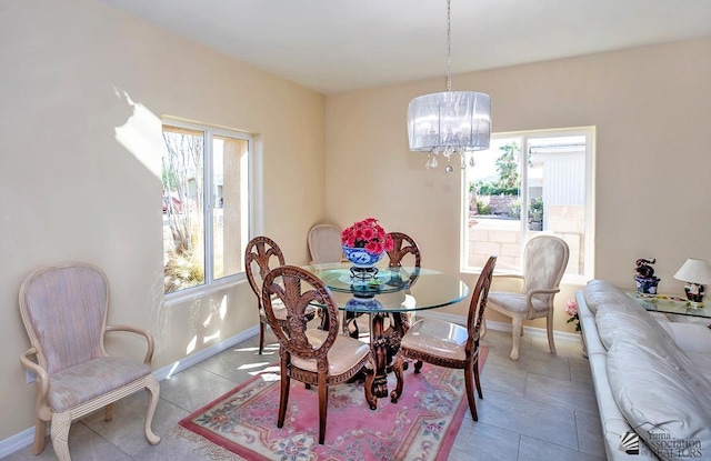 13459 E 43rd Ln, Yuma, AZ 85367 - dining room featuring baseboards and a notable chandelier
