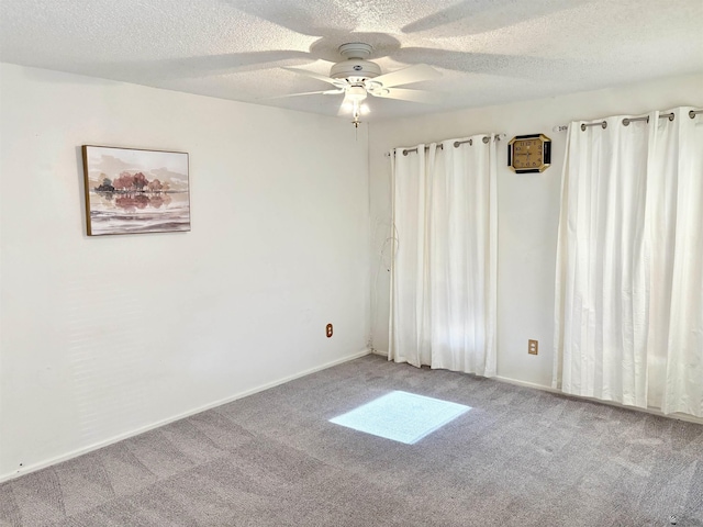 4447 W 14th Pl, Yuma, AZ 85364 - unfurnished room featuring carpet flooring, ceiling fan, and a textured ceiling