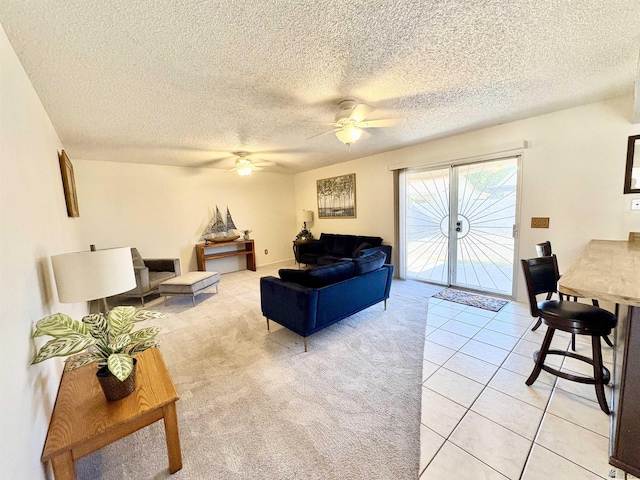 4447 W 14th Pl, Yuma, AZ 85364 - living area featuring a ceiling fan, a textured ceiling, light colored carpet, and light tile patterned floors