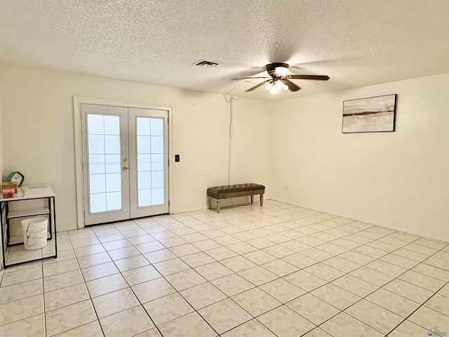 4447 W 14th Pl, Yuma, AZ 85364 - doorway to outside featuring ceiling fan, french doors, light tile patterned flooring, and a textured ceiling