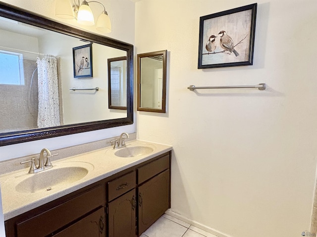 4447 W 14th Pl, Yuma, AZ 85364 - full bath with double vanity, tile patterned floors, and curtained shower