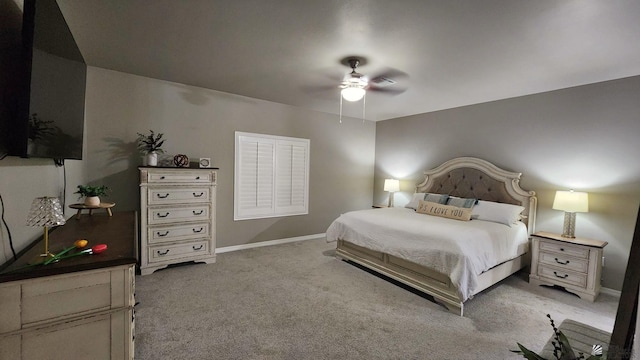 11569 Sonora St, Wellton, AZ 85356 - bedroom featuring light carpet, baseboards, and a ceiling fan