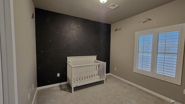 11569 Sonora St, Wellton, AZ 85356 - unfurnished bedroom featuring carpet flooring, baseboards, and a nursery area