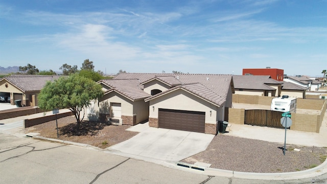 11569 Sonora St, Wellton, AZ 85356 - ranch-style house featuring stucco siding, a garage, a tiled roof, and stone siding