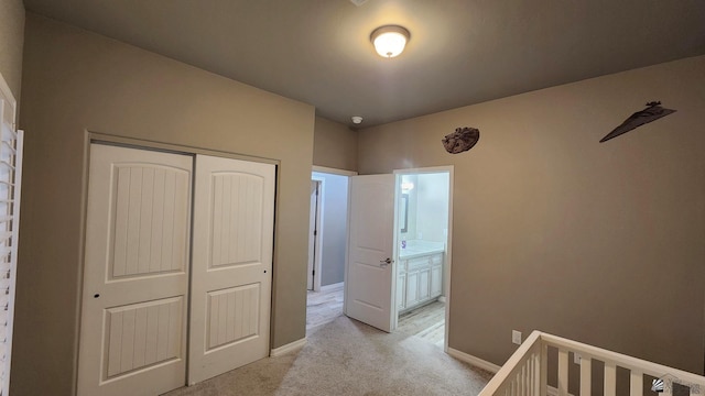11569 Sonora St, Wellton, AZ 85356 - bedroom with light colored carpet, a closet, and baseboards
