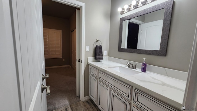11569 Sonora St, Wellton, AZ 85356 - bathroom featuring vanity, wood finished floors, and baseboards