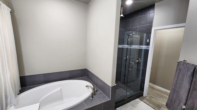 11569 Sonora St, Wellton, AZ 85356 - full bath with a stall shower, a bath, and wood finished floors