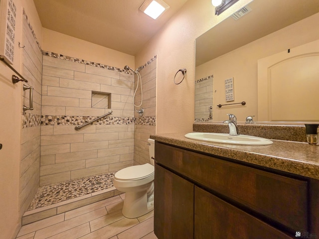 10791 S Sonora St, Yuma, AZ 85367 - bathroom featuring vanity, toilet, tiled shower, and visible vents