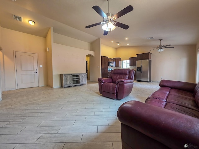 10791 S Sonora St, Yuma, AZ 85367 - living room featuring visible vents, arched walkways, ceiling fan, and vaulted ceiling