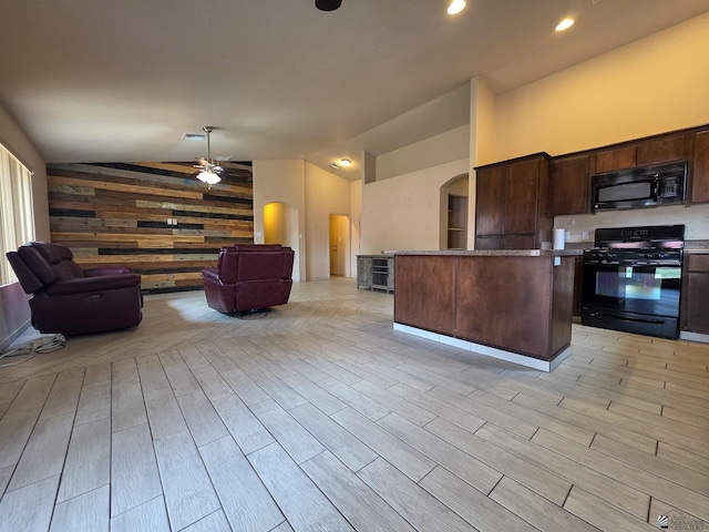 10791 S Sonora St, Yuma, AZ 85367 - kitchen featuring dark brown cabinetry, a ceiling fan, arched walkways, black appliances, and lofted ceiling