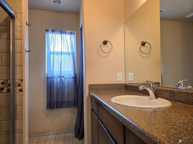 10791 S Sonora St, Yuma, AZ 85367 - full bathroom with vanity, a tile shower, and visible vents