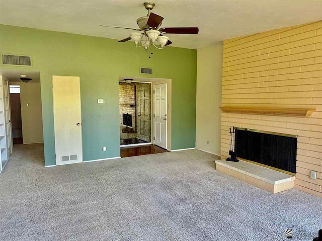 500 E Country Club Dr # 24, Yuma, AZ 85365 - unfurnished living room featuring visible vents, carpet floors, and a fireplace